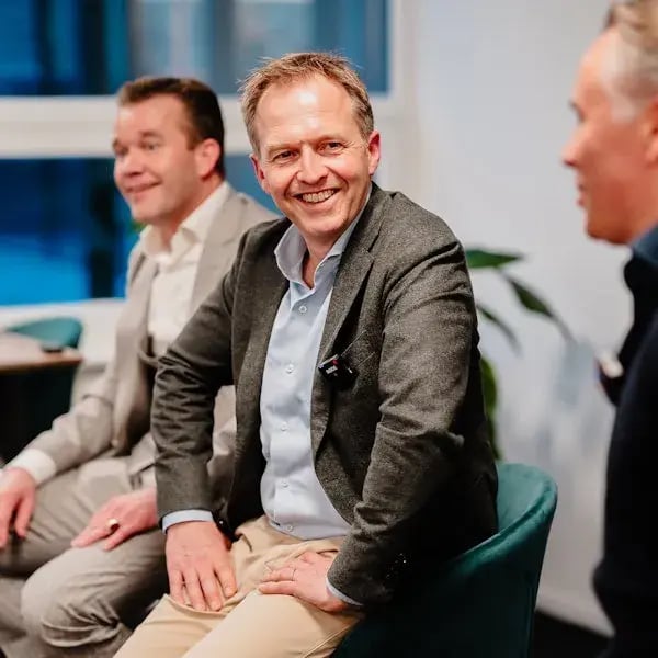 Man in the audience laughing.