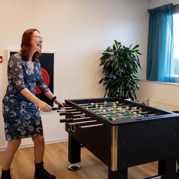 Woman at foosball table