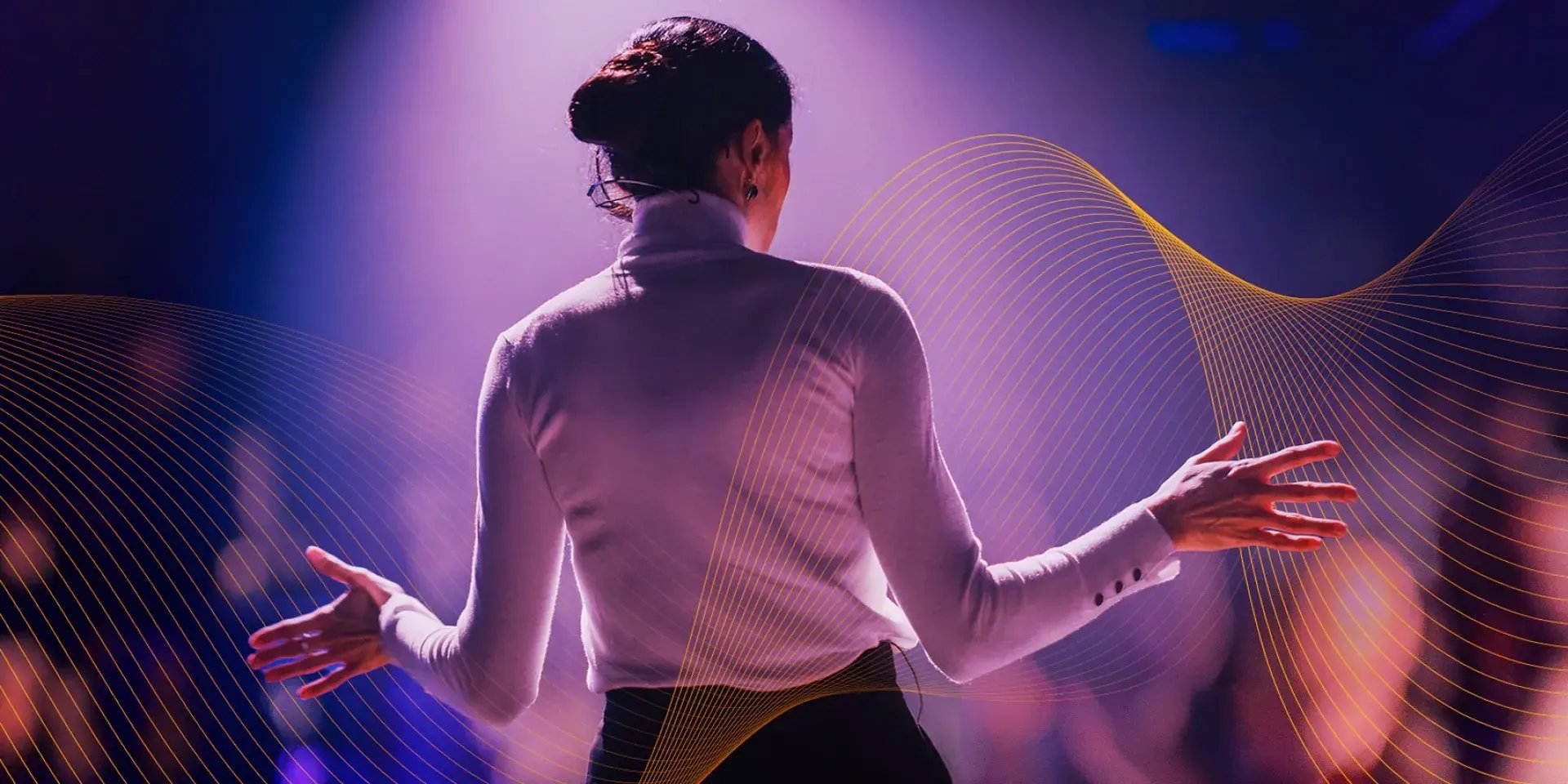 Back of a woman with open arms.